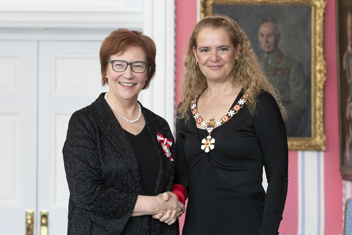 University of Calgary Faculty of Arts prof Aritha van Herk, left, is invested as a Member of the Order of Canada by Governor General Julie Payette, March 14, 2019 in Ottawa.