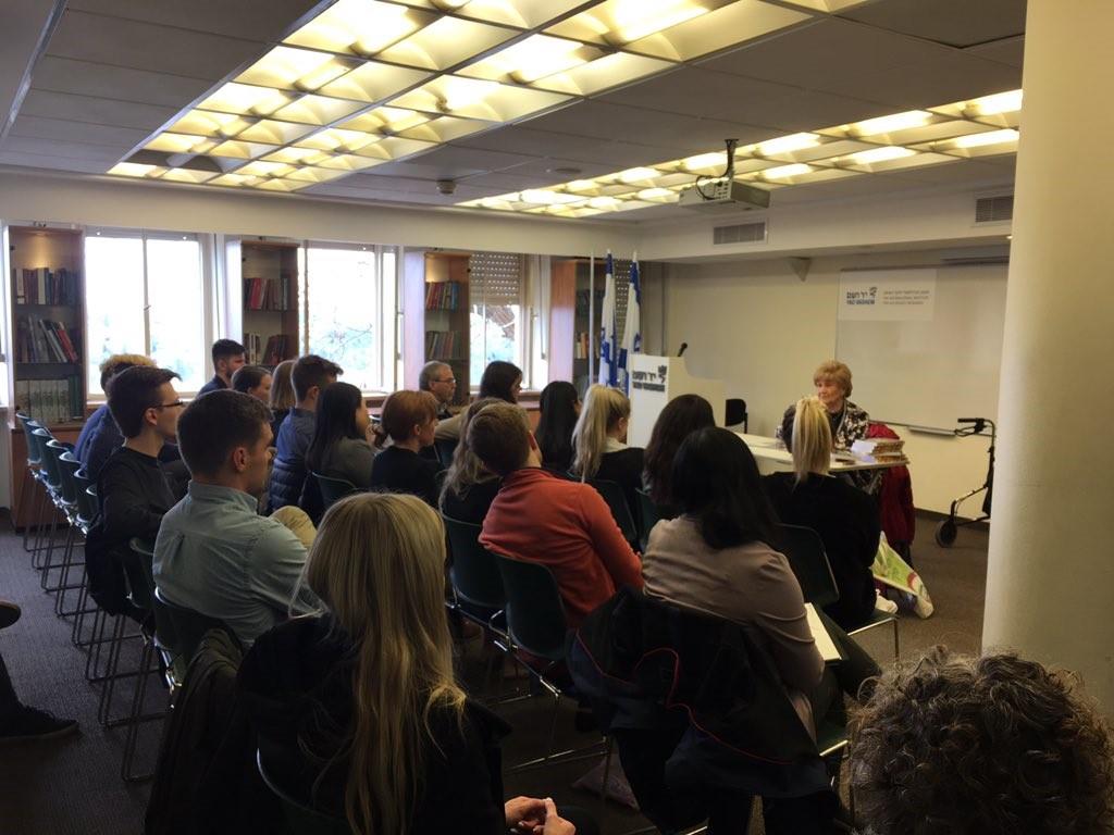 Students speak with Holocaust survivor Rena Quint.