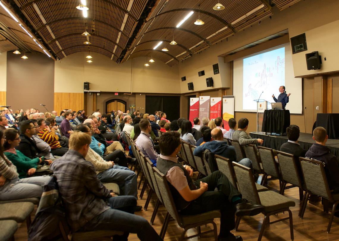 Seth Lloyd speaks to a sold-out crowd about teleportation, time travel and escape from black holes at the IQST Annual Quantum Public Lecture on Nov. 18, 2015. 