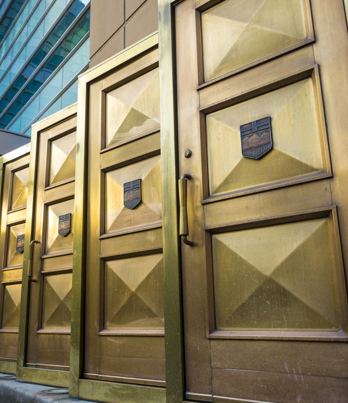 The golden doors of the old Calgary Courthouse now stand outside the Calgary Courts Centre, the largest court facility in Canada and the second largest in North America.