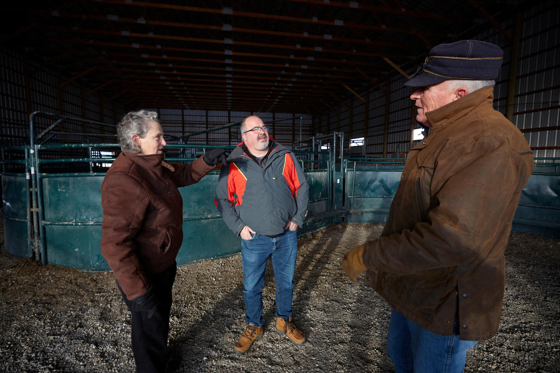 Dr. Grandin discusses cattle handling practices with Ed Pajor and Matt Williams. 