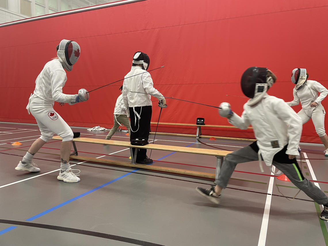 Complete with full gear, electronic scoring, and officials Olympic fencers Alanna Goldie and Kelleigh dueled with kids in Active Living's fencing summer camp.