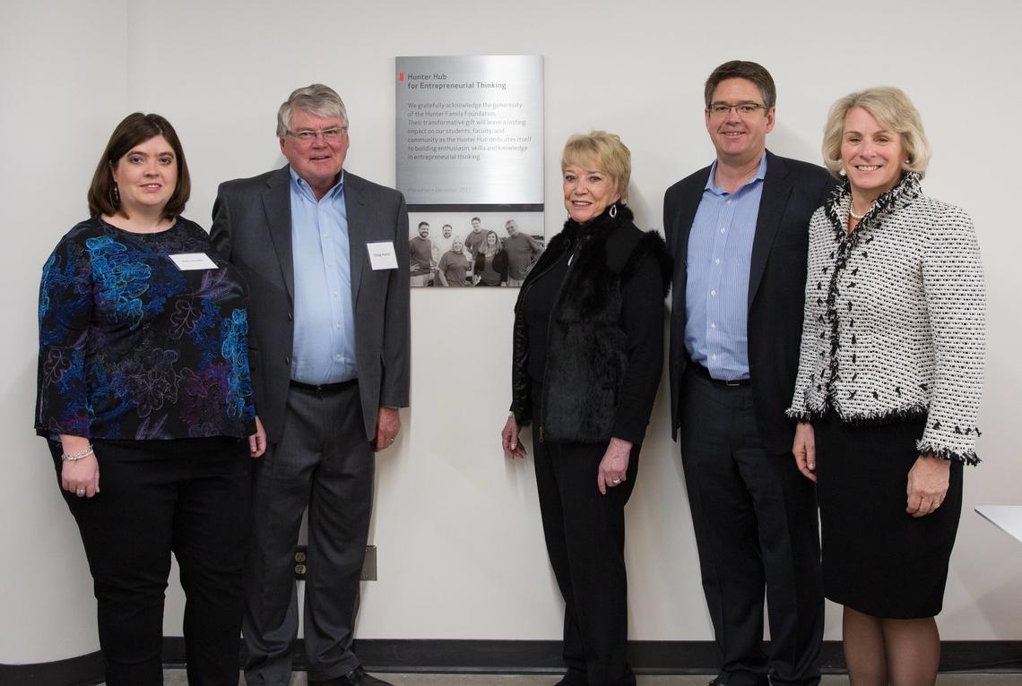 Former University of Calgary President Elizabeth Cannon, right, joins Dani, Doug, Diane and Derrick Hunter at the launch of the Hunter Hub interim Collision Space in December 2017.