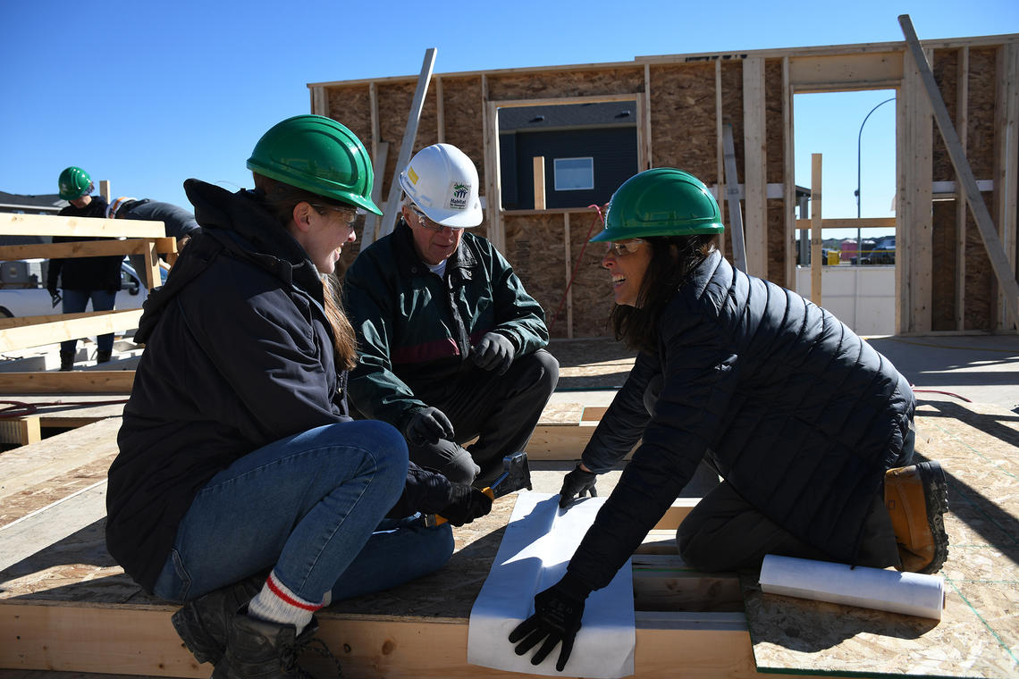 Colleen Ogilvie, Adrian, a volunteer with Habitat for Humanity, and Veronica Briseno Castrejon