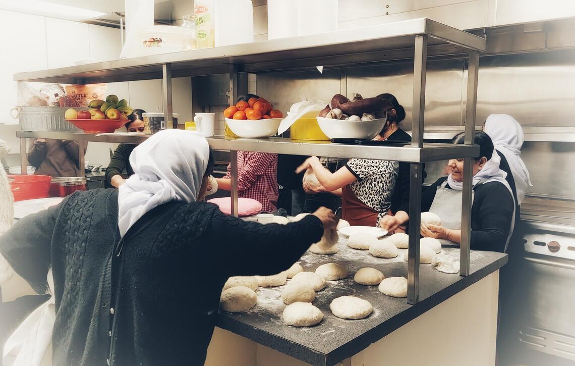 Yazidi women baking at Rockpointe Community Church