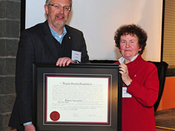 Royal Society of Canada president Yolande Grisé congratulates the University of Calgary’s Hans Vogel on his appointment as a society fellow. 