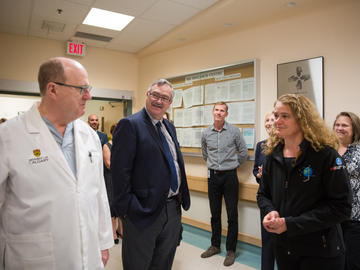 Dr. Garnette Sutherland, professor of neurosurgery, shares a few words with Canada’s Gov. Gen. Julie Payette as dean of medicine Dr. Jon Meddings looks on before heading into the operating room for a demonstration of the neuroArm.