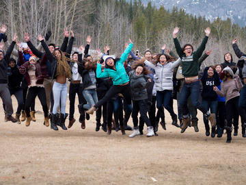 Many students jump up in the air