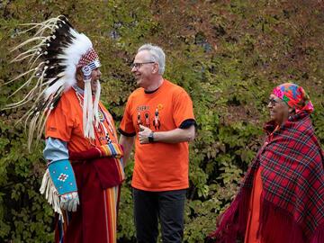 The two Elders are greeted by President McCaulay during Orange Shirt Day 2022