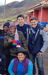 Engineering students pose with villagers in Peru
